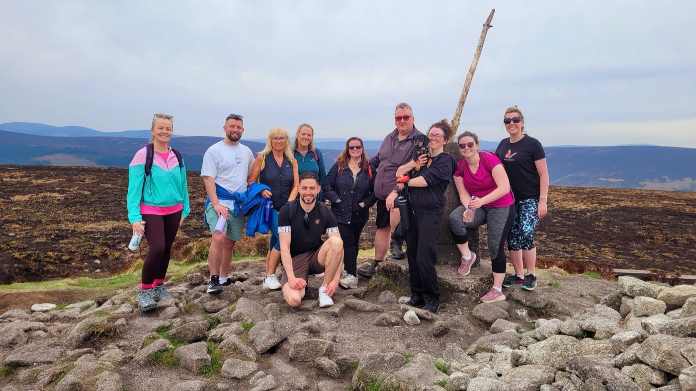 Coach Elan with clients on a community hike in Ireland